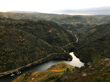 High angle view of river amidst mountains