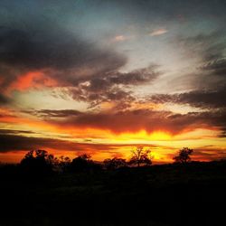 Scenic view of landscape against cloudy sky