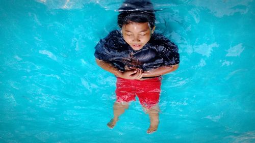 Full length of a boy swimming in pool