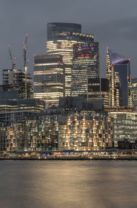 Illuminated buildings in city at night