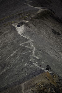 Person walking on foodpath on vulcano
