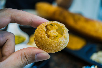 Close-up of hand holding ice cream