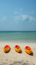 Scenic view of beach against blue sky