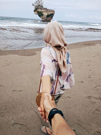 Rear view of woman on beach