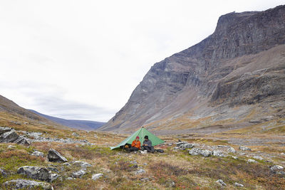 Couple camping in mountains