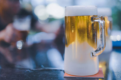 Close-up of beer glass on table