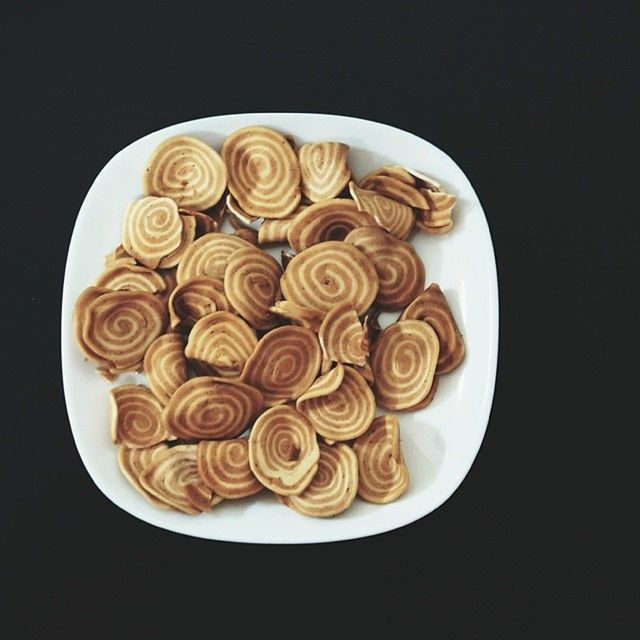 food and drink, food, freshness, still life, indoors, studio shot, table, plate, ready-to-eat, directly above, healthy eating, close-up, indulgence, high angle view, black background, sweet food, temptation, no people, serving size, dessert