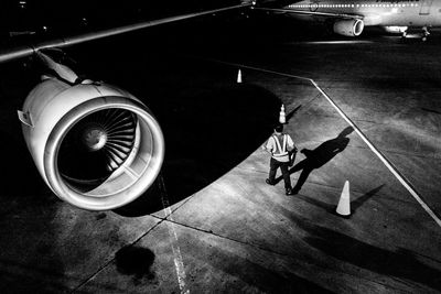 High angle view of man working at airport runway