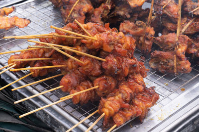 High angle view of meat on barbecue grill