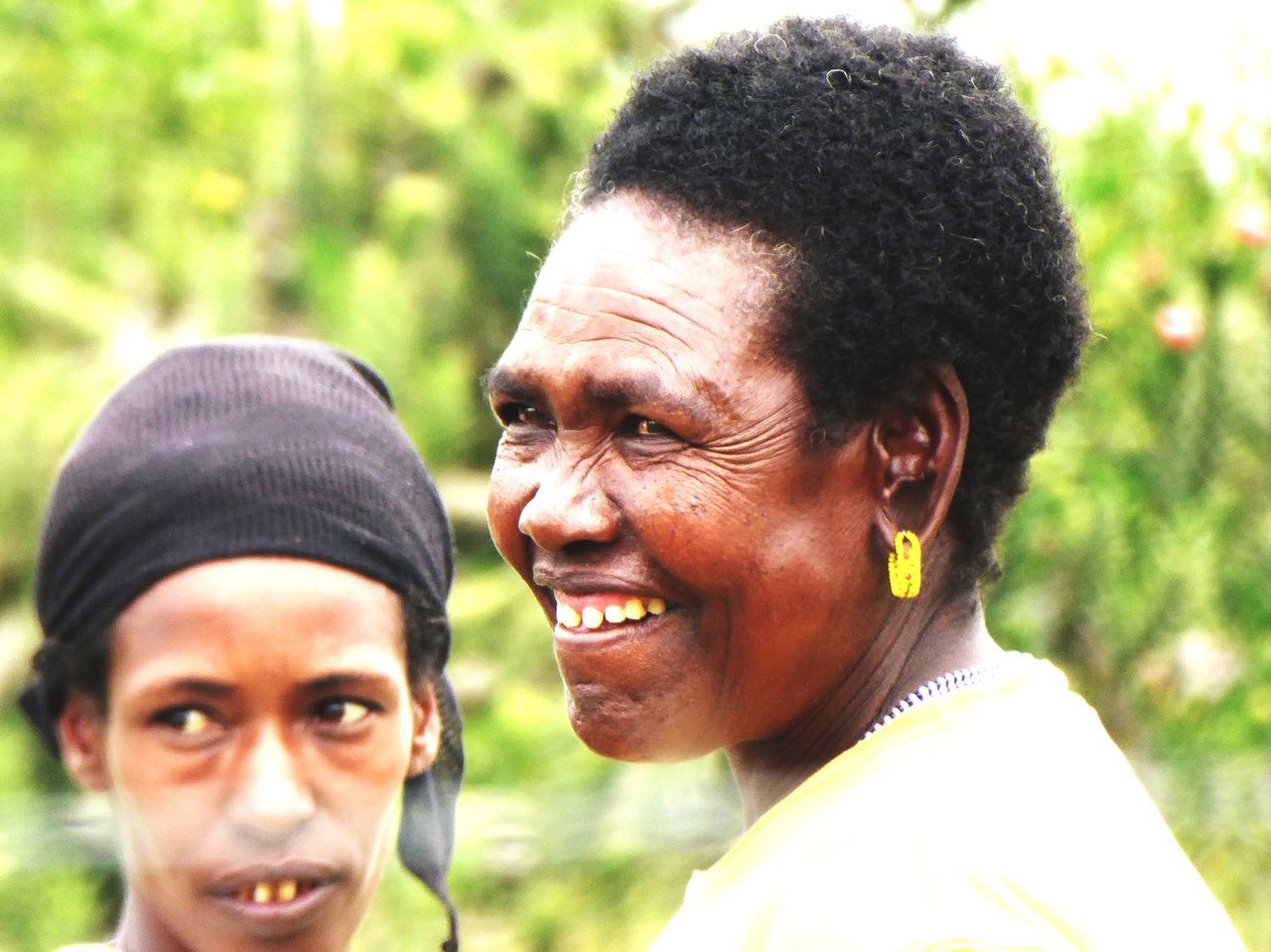 two people, togetherness, focus on foreground, headshot, smiling, outdoors, happiness, looking at camera, love, cheerful, real people, bonding, lifestyles, day, men, portrait, young adult, close-up, young women, tree, people