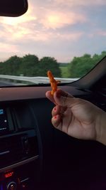 Close-up of hand holding car