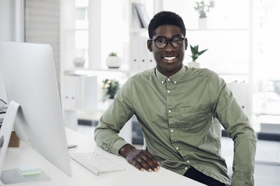 Portrait of young man using smart phone