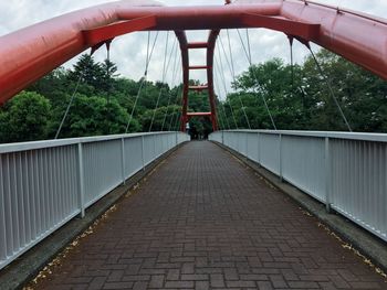 Rear view of man on footbridge