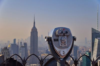 View of modern cityscape against clear sky