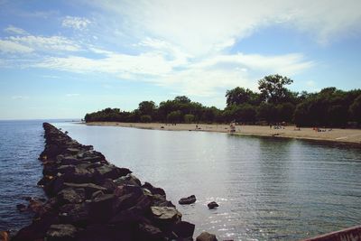 Scenic view of sea against cloudy sky