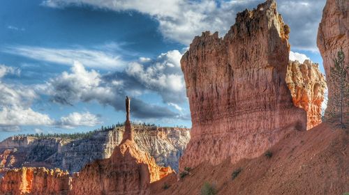 Panoramic view of rock formations against sky