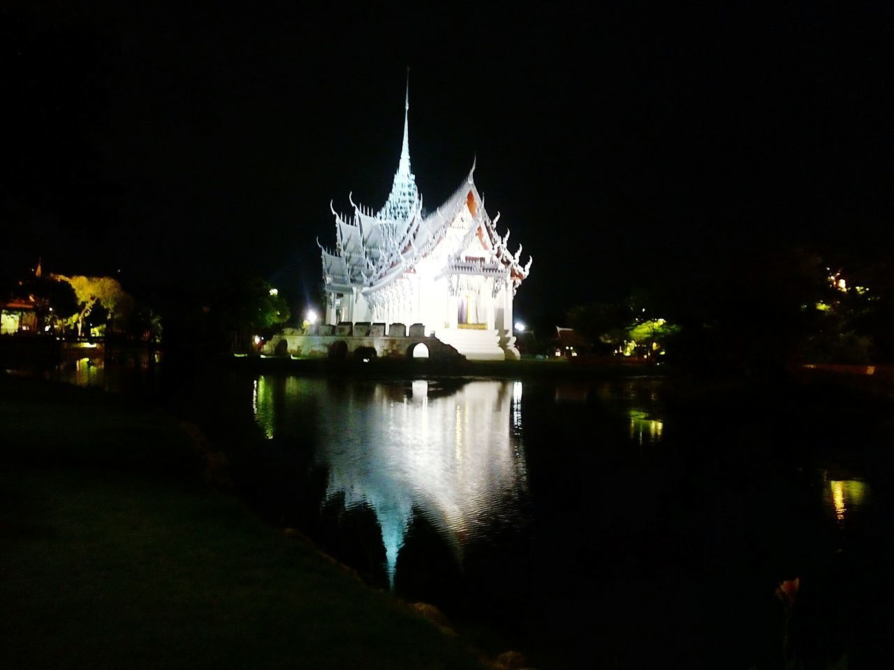 night, illuminated, architecture, built structure, building exterior, reflection, water, waterfront, religion, place of worship, river, sky, spirituality, clear sky, city, famous place, tree, outdoors, travel destinations