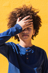 Portrait of boy standing outdoors