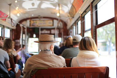 Rear view of people sitting in bus