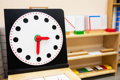 Close-up of clock on table