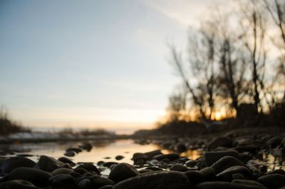 Close-up of water against sky during sunset