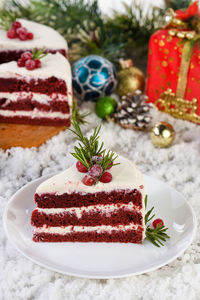 Red velvet cake is a traditional red chocolate cake topped with white buttercream 