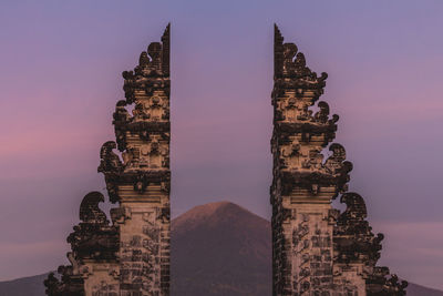 Low angle view of historical building against sky during sunset