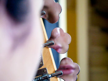 Side view of a person playing guitar