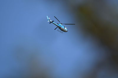 Low angle view of airplane flying in sky