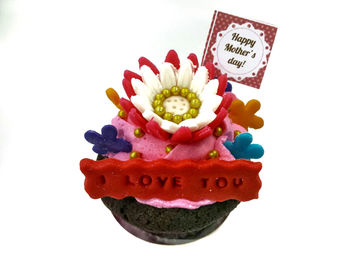 Close-up of birthday cake against white background