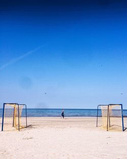 Scenic view of calm sea against clear sky