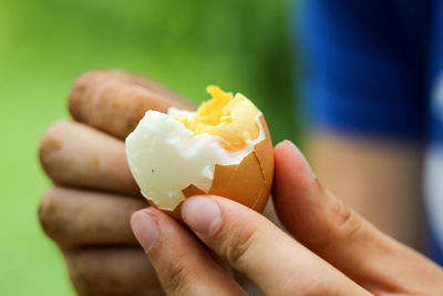 Close-up of hand holding ice cream