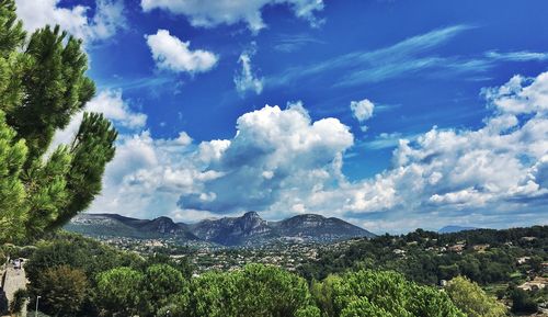 Panoramic view of landscape against blue sky