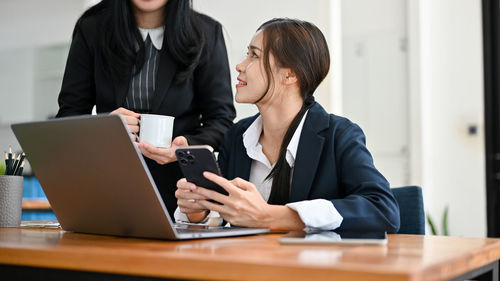 Business colleagues working at office