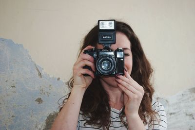 Portrait of woman photographing