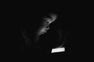 Portrait of girl in darkroom