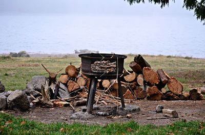Rusty metallic structure by sea against sky