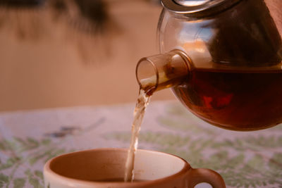 Teapot pouring tea