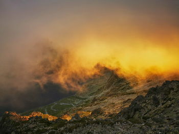 Fog over the mountain valley illuminated by the sunset. tatra mountains slovakia.