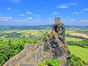 View of old ruin on landscape against sky