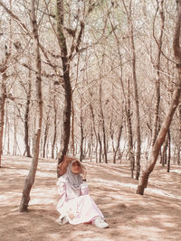 Full length of woman with trees and plants