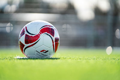 Close-up of soccer ball on field