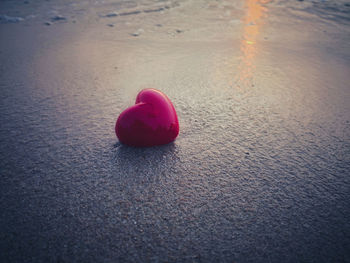 Close-up of heart shape on sand