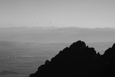 Scenic view of silhouette mountain against clear sky