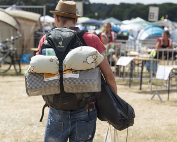 Rear view of man standing outdoors