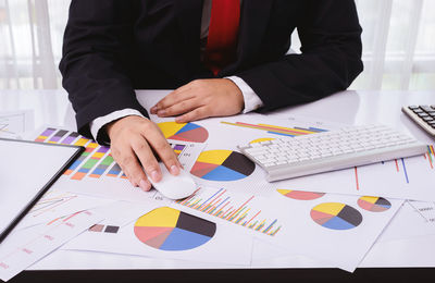 Low angle view of man working on table