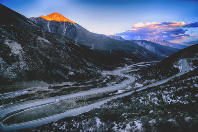 Scenic view of mountains against sky during winter