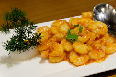 Close-up of prawns served on table