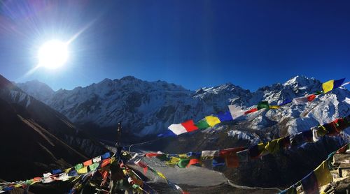 View of buntings against snowcapped mountains 