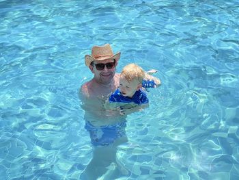 High angle view of man swimming in pool